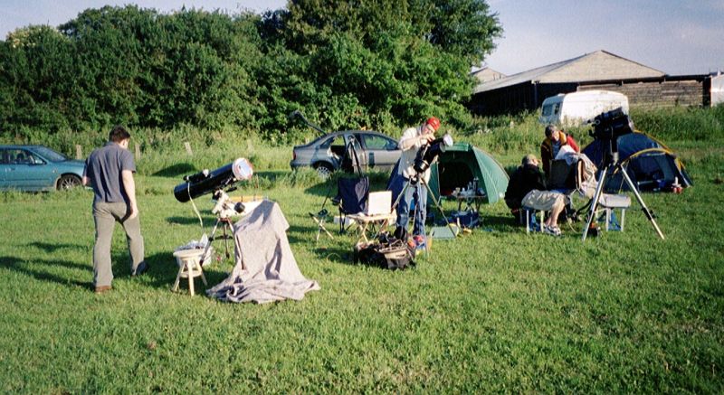 Transit of Venus, June 2004
An array of telescopes with various solar filters being set up in the boot fair field at Chelsfield to observe the Transit of Venus on 8th June 2004.
Link-words: LocalArea2004