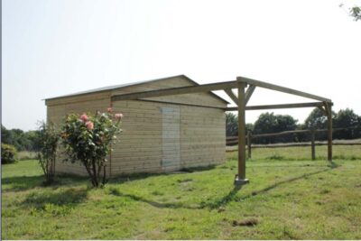 A large shed with a support frame onto which the shed's roof can be rolled when the observatory is to be used